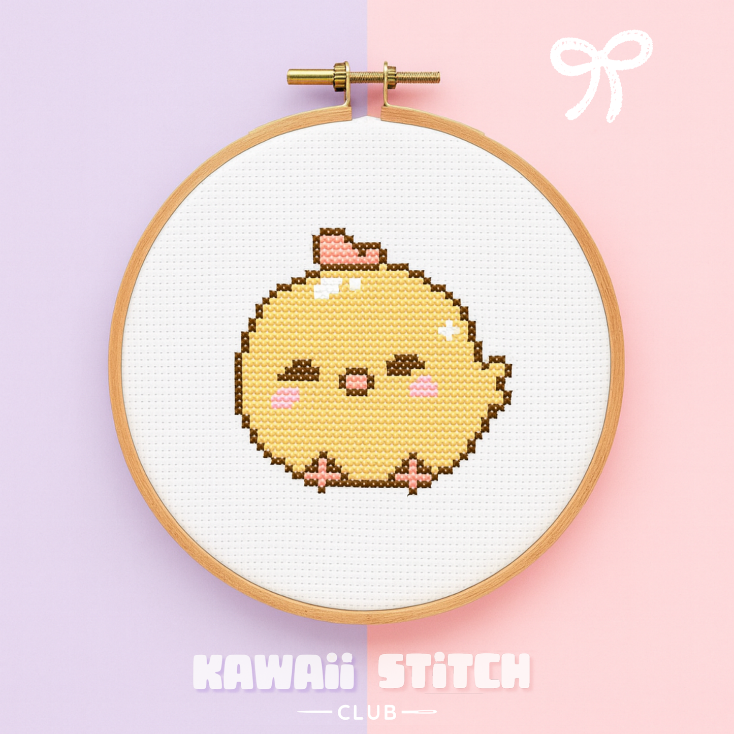 Yellow baby chick cross stitch design displayed in a wooden embroidery hoop