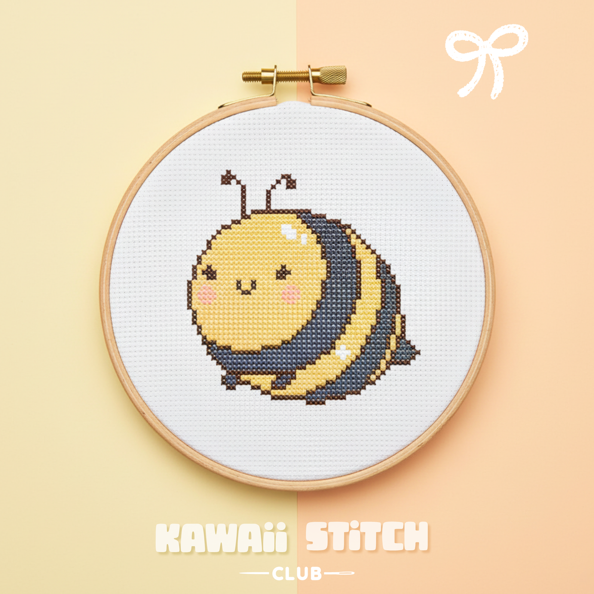 Kawaii bee cross stitch design displayed in a wooden embroidery hoop