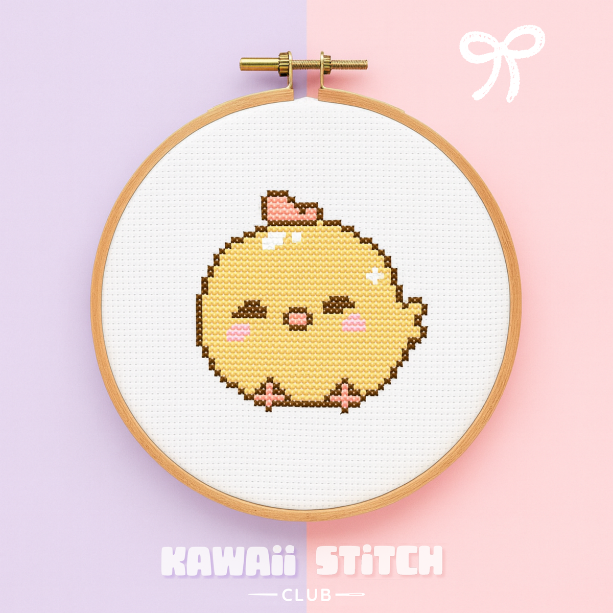 Yellow baby chick cross stitch design displayed in a wooden embroidery hoop