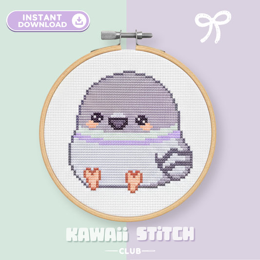 Baby pigeon cross stitch pattern stitched in a wooden hoop on a mint and lavender background