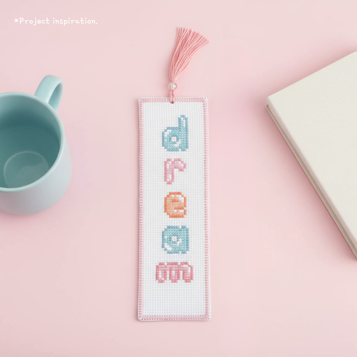 Dream cross stitch bookmark made with pastel lowercase bubble letters