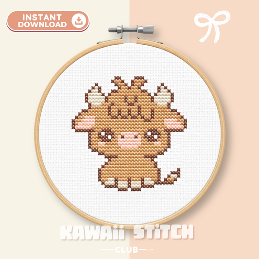 Mini Highland cow cross stitch pattern stitched in a wooden hoop