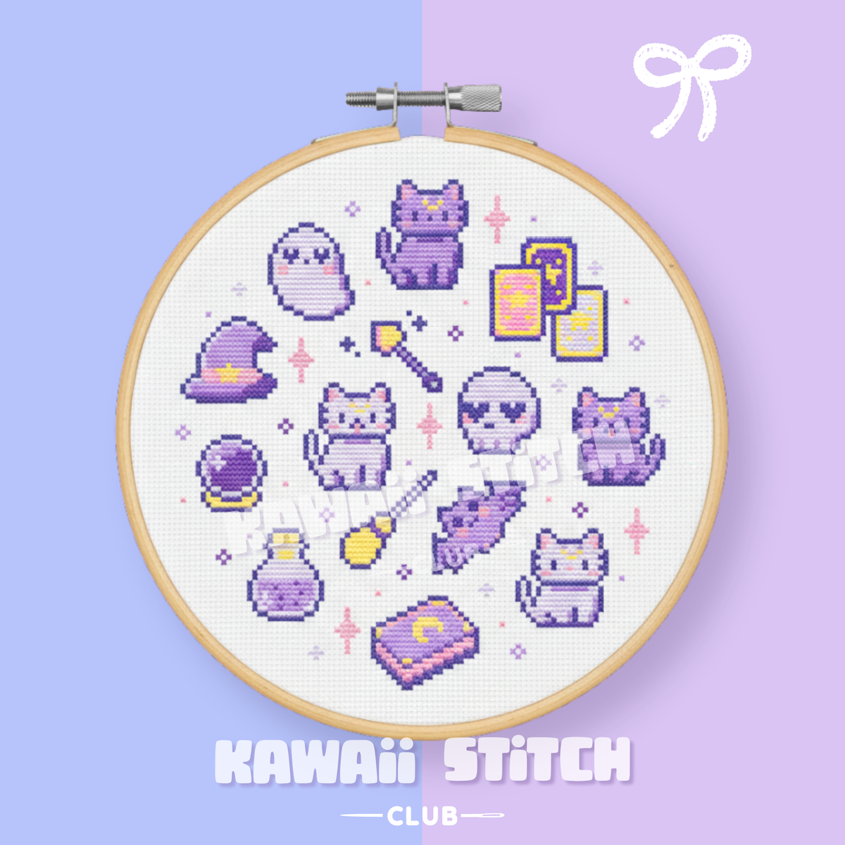 Finished pastel witchy cats and magic motifs cross stitch displayed in a wooden hoop