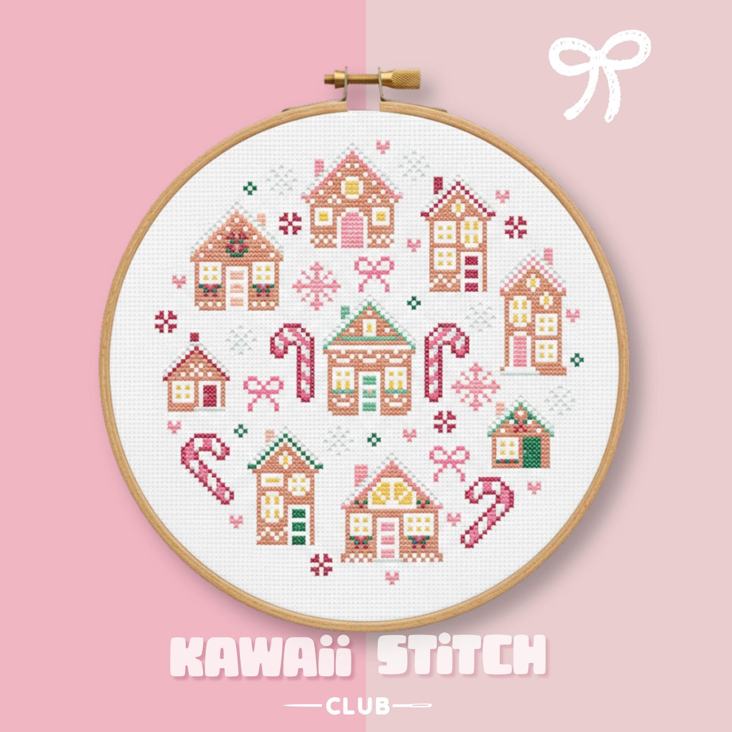 Pastel gingerbread house Christmas village displayed in a wooden embroidery hoop
