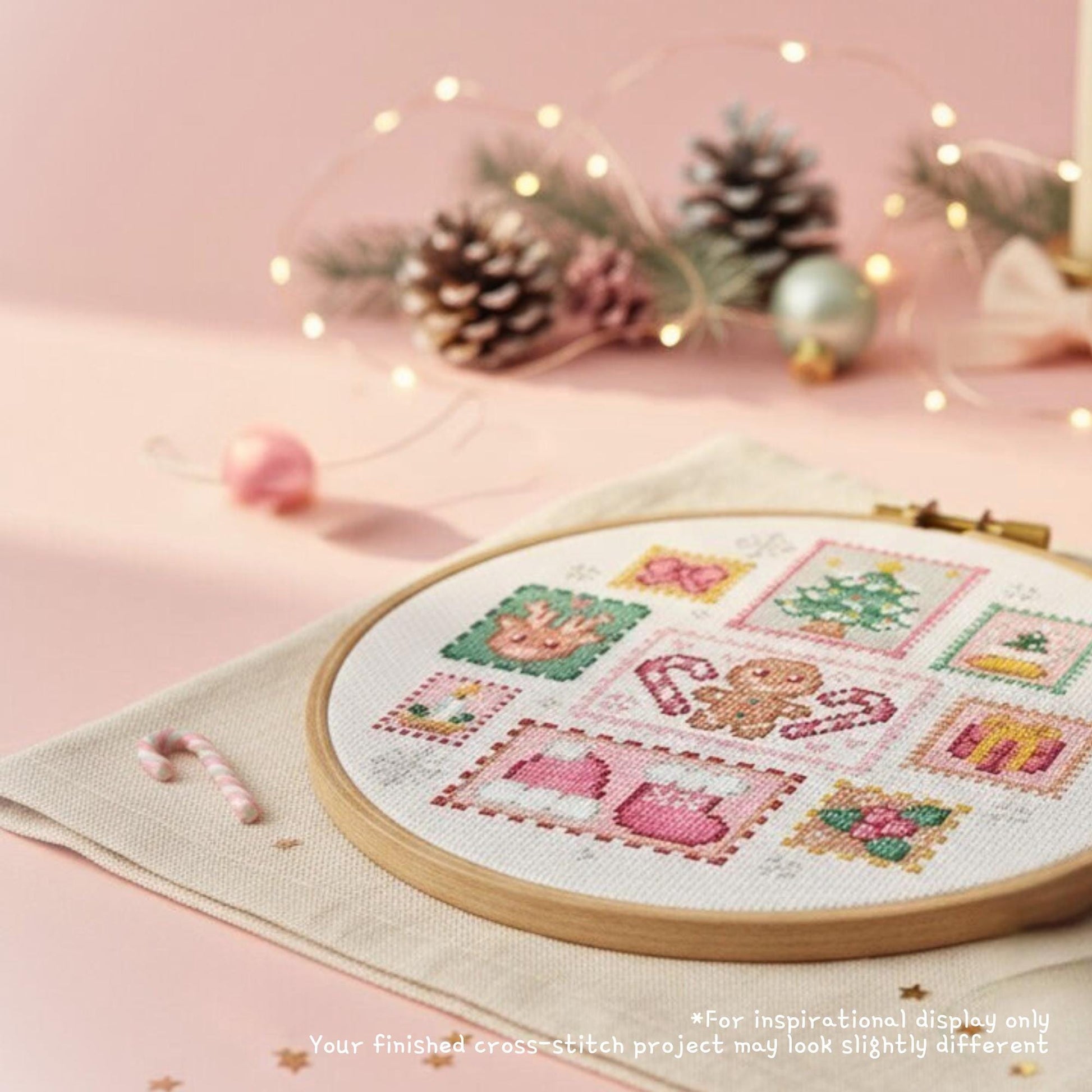 Finished mini Christmas stamp cross stitch in a hoop with gingerbread, tree, reindeer and stockings